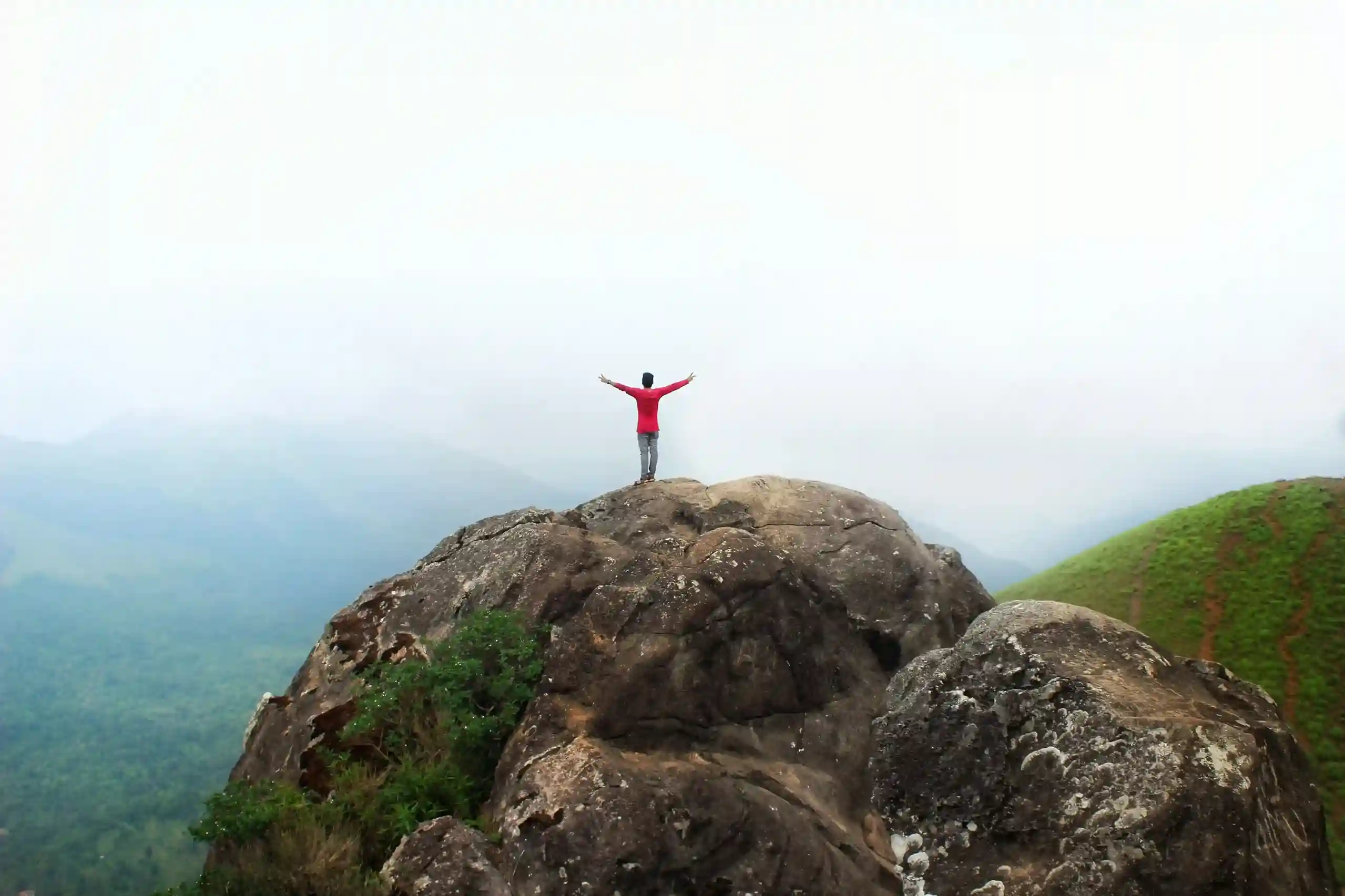 a person standing on top of the ranipuram peak